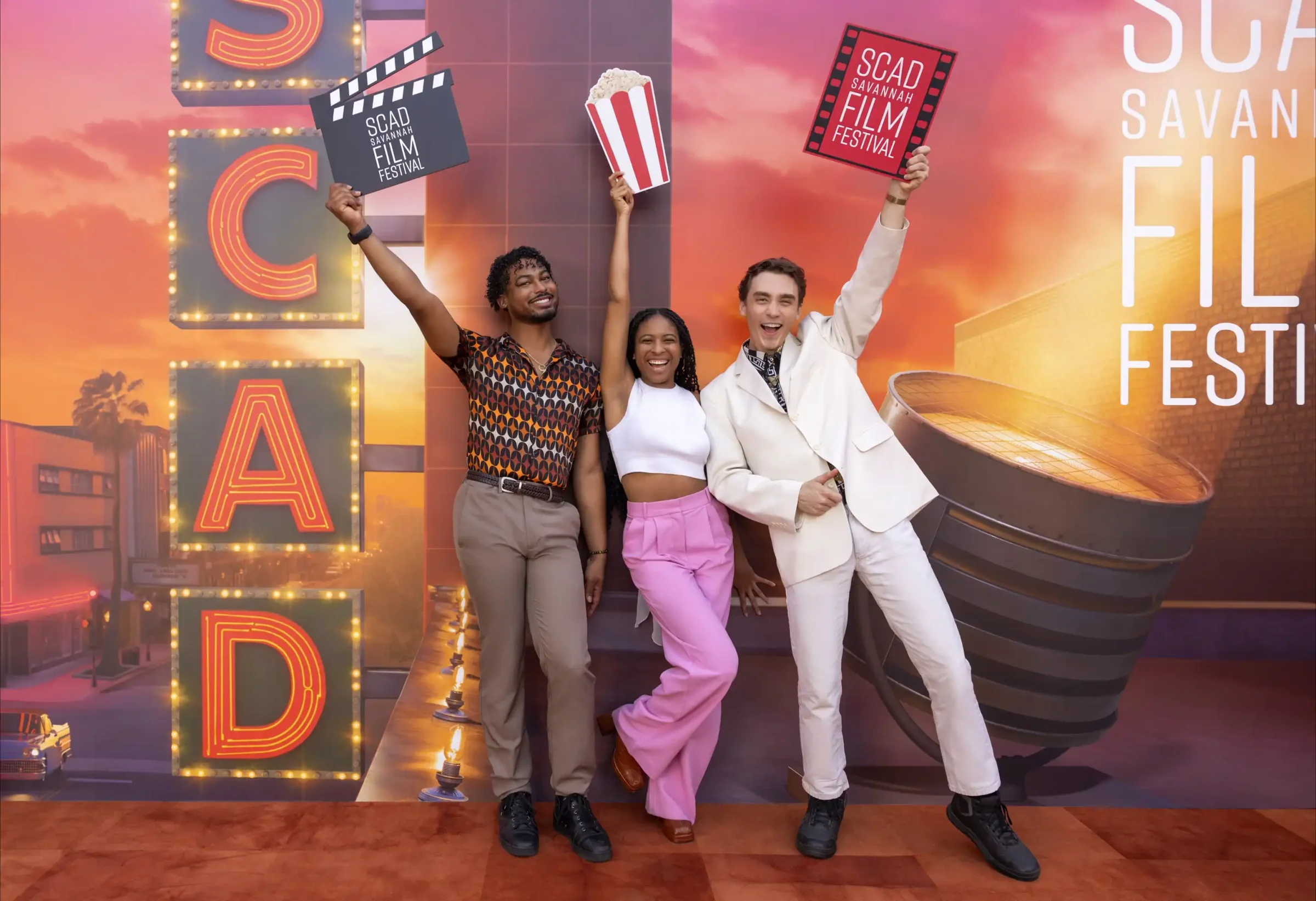 models posing for a poster for the SCAD Film Festival